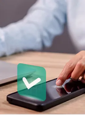 Hand touching a smartphone with a check icon.