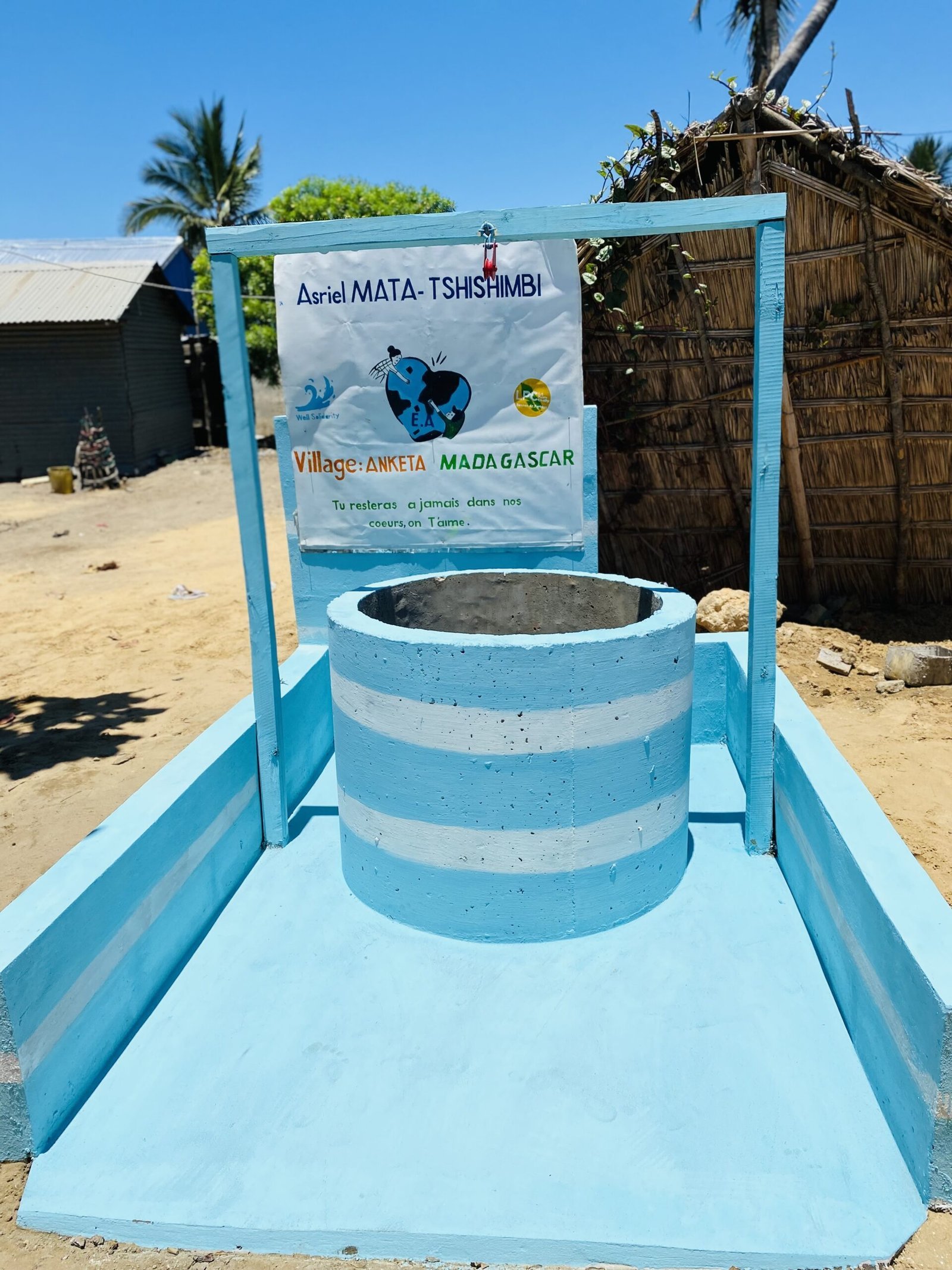 Classic hand-dug water well with concrete rings and a blue platform in Madagascar, built by Well Solidarity